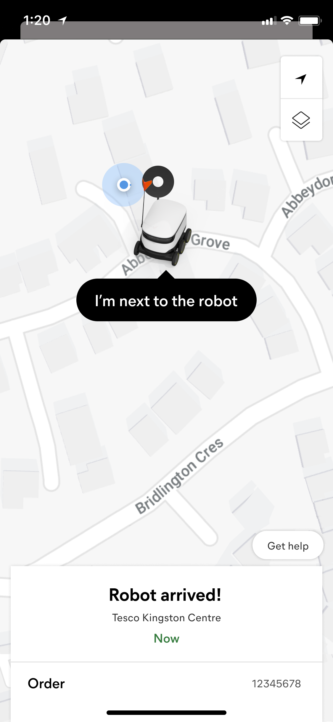 Starship app screen confirming the robot has arrived, with an 'I'm next to the robot' locator prompt